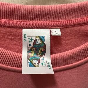 Queen of Sparkles pink ruffle long sleeve top in Large